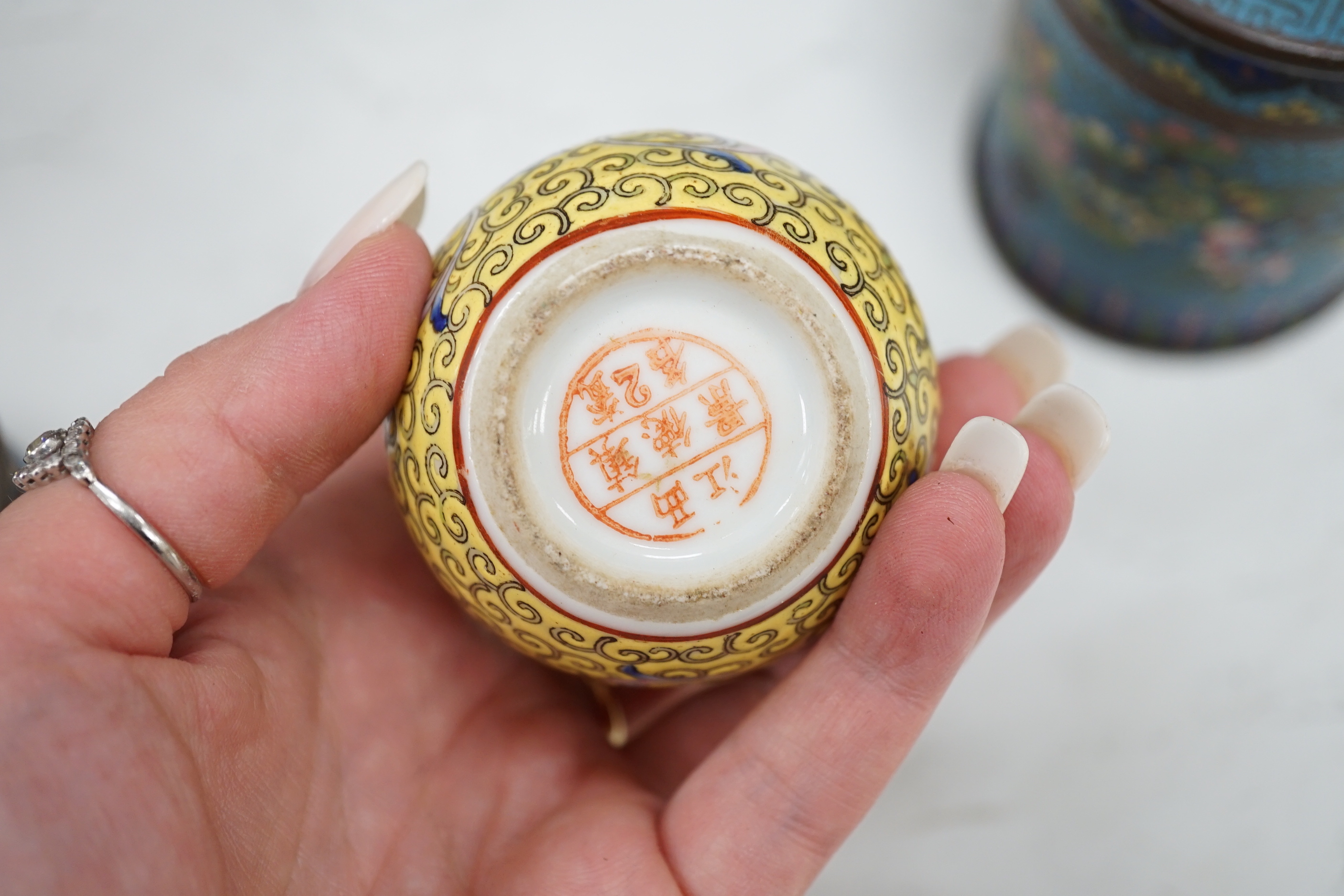 A collection of 20th century Chinese and Japanese ceramics including pair of Imari bottle neck vases, blue and white jar and cover and a pair of dog of foo pots and covers (one cover missing) together with two cloisonné